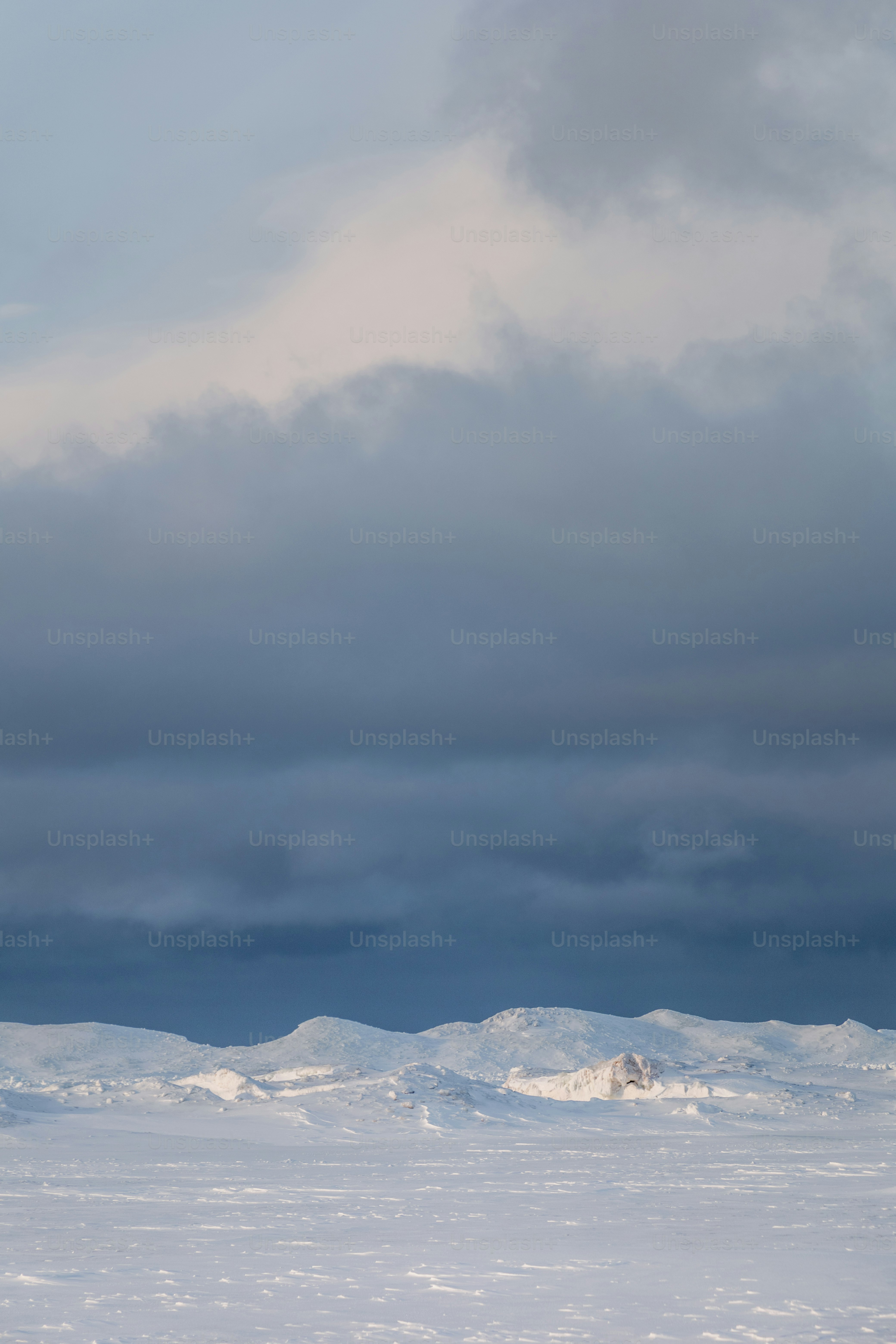 a person walking across a snow covered field