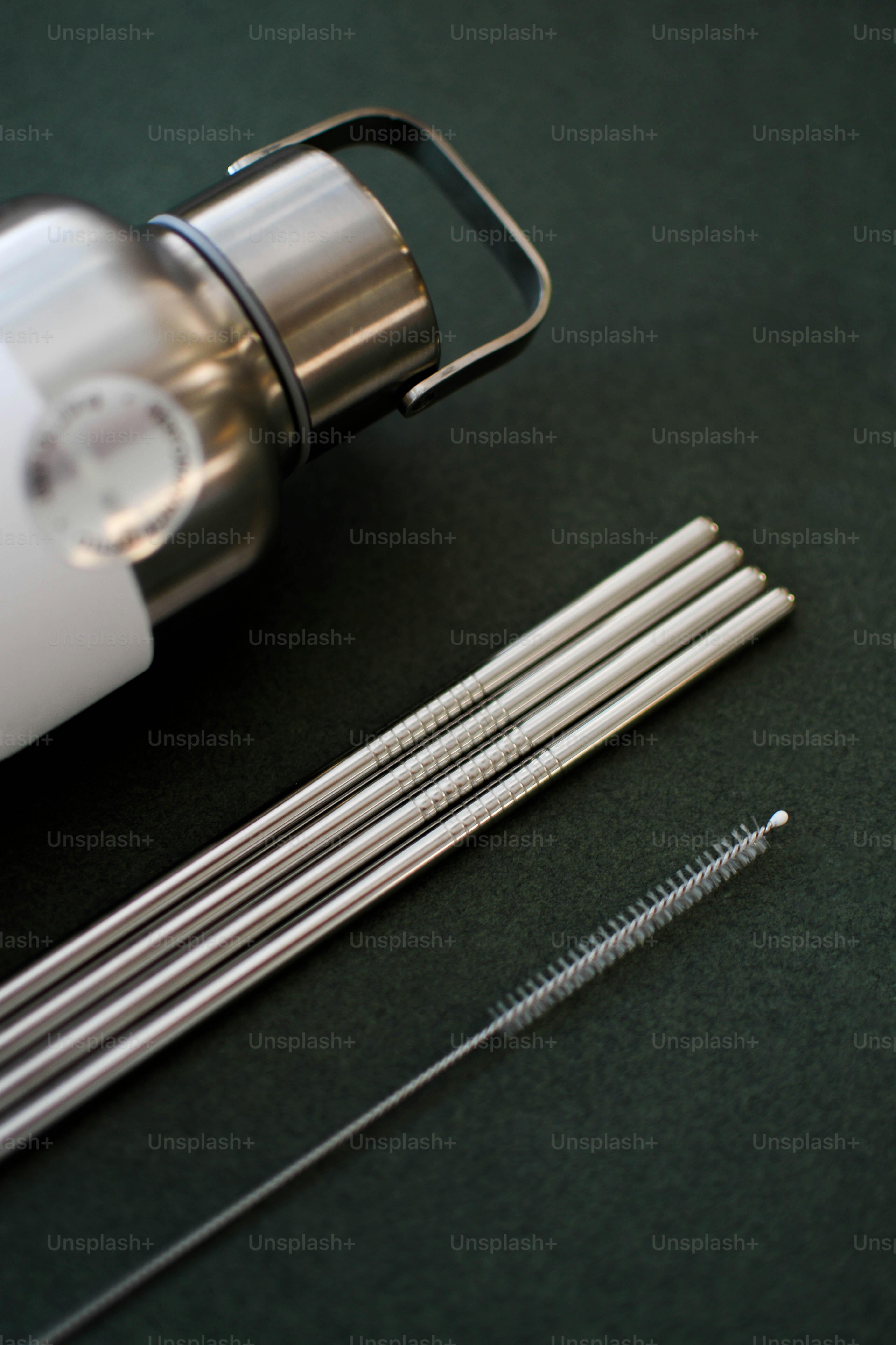 a close up of a blender and some straws