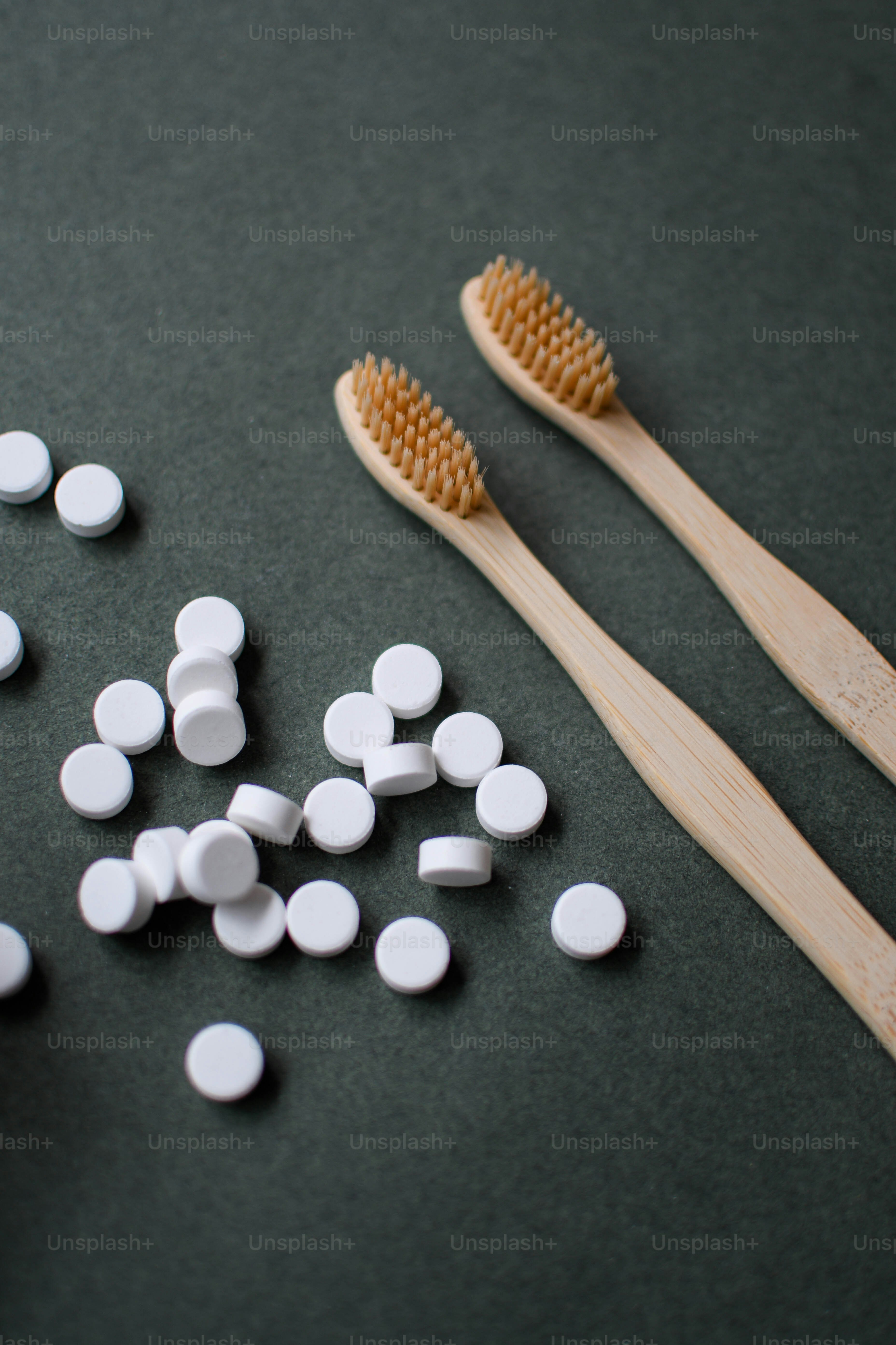 a couple of toothbrushes sitting on top of a table