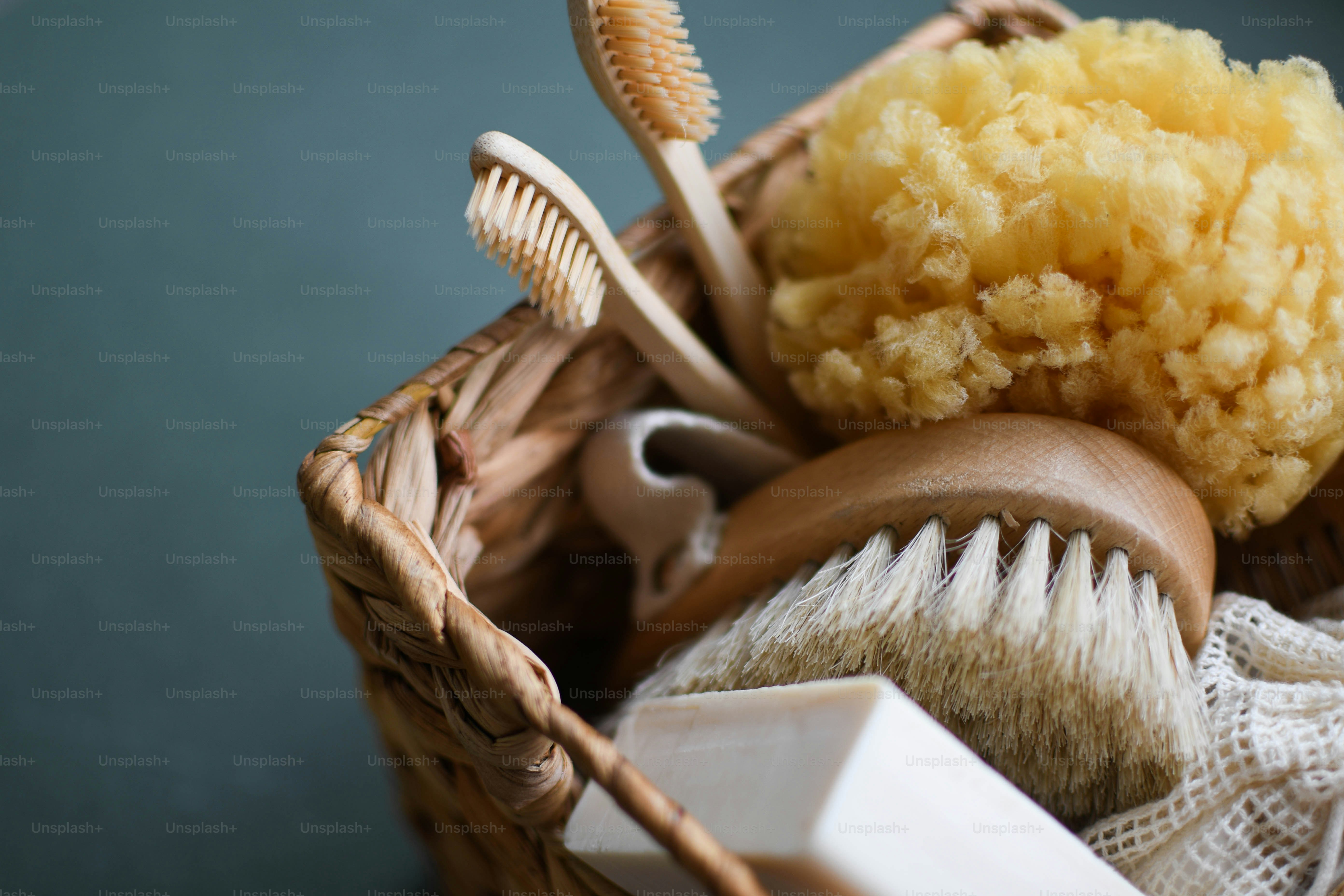 a basket filled with different types of hair brushes