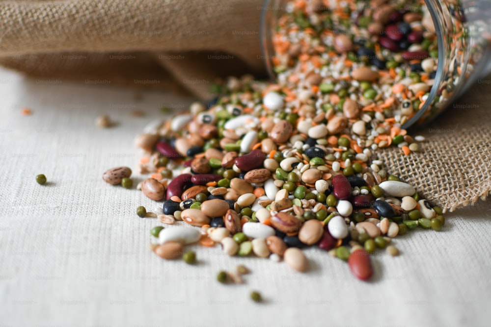a pile of beans and other food on a table