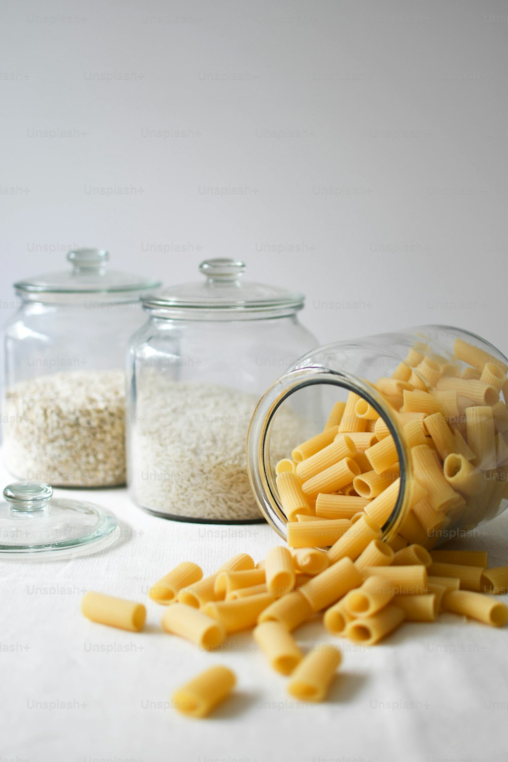 macaroni and cheese are spilled out of a jar