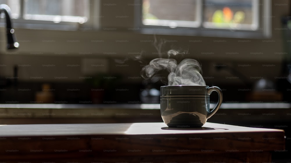 a steaming cup on a counter in a kitchen