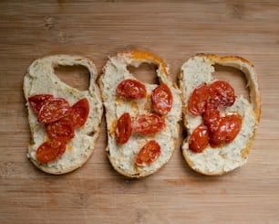 two slices of bread with tomatoes on them