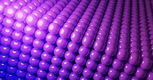 a large group of purple balls in a room