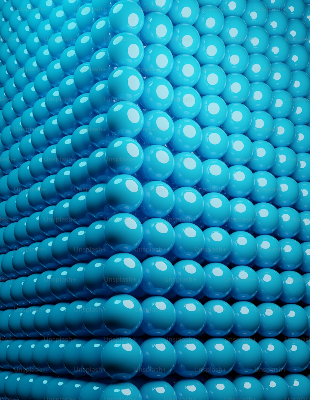 a large group of blue balls in the shape of a pyramid