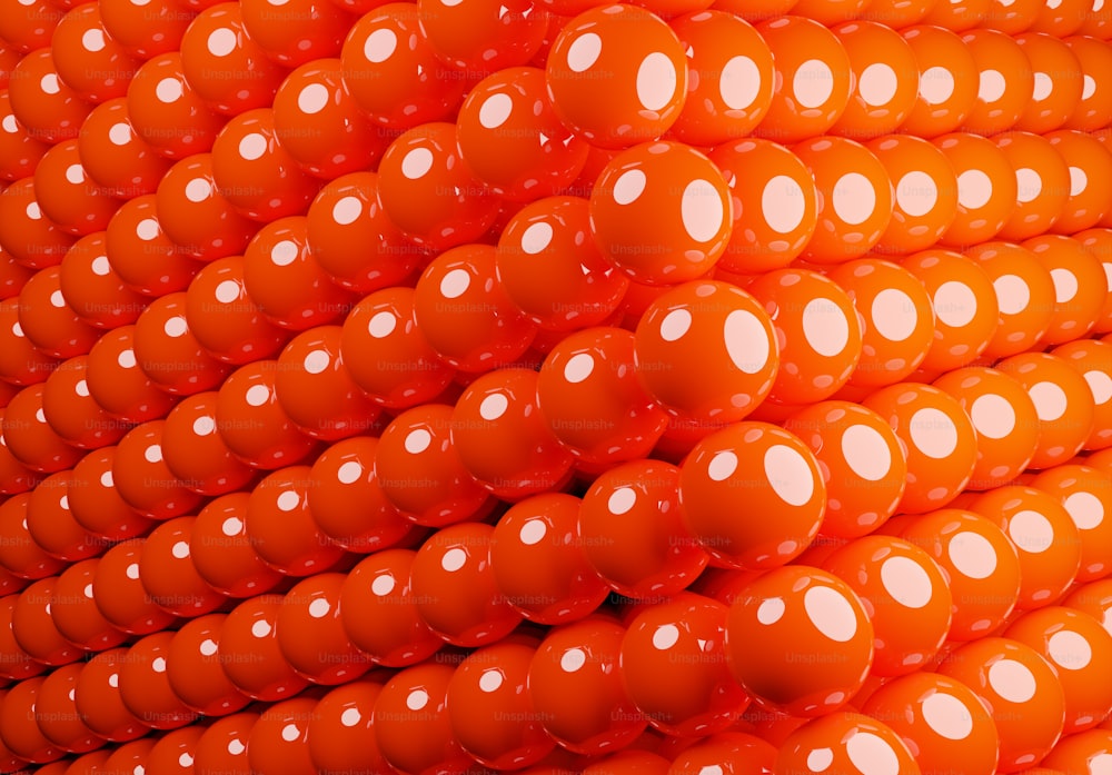 a large pile of orange and white balls