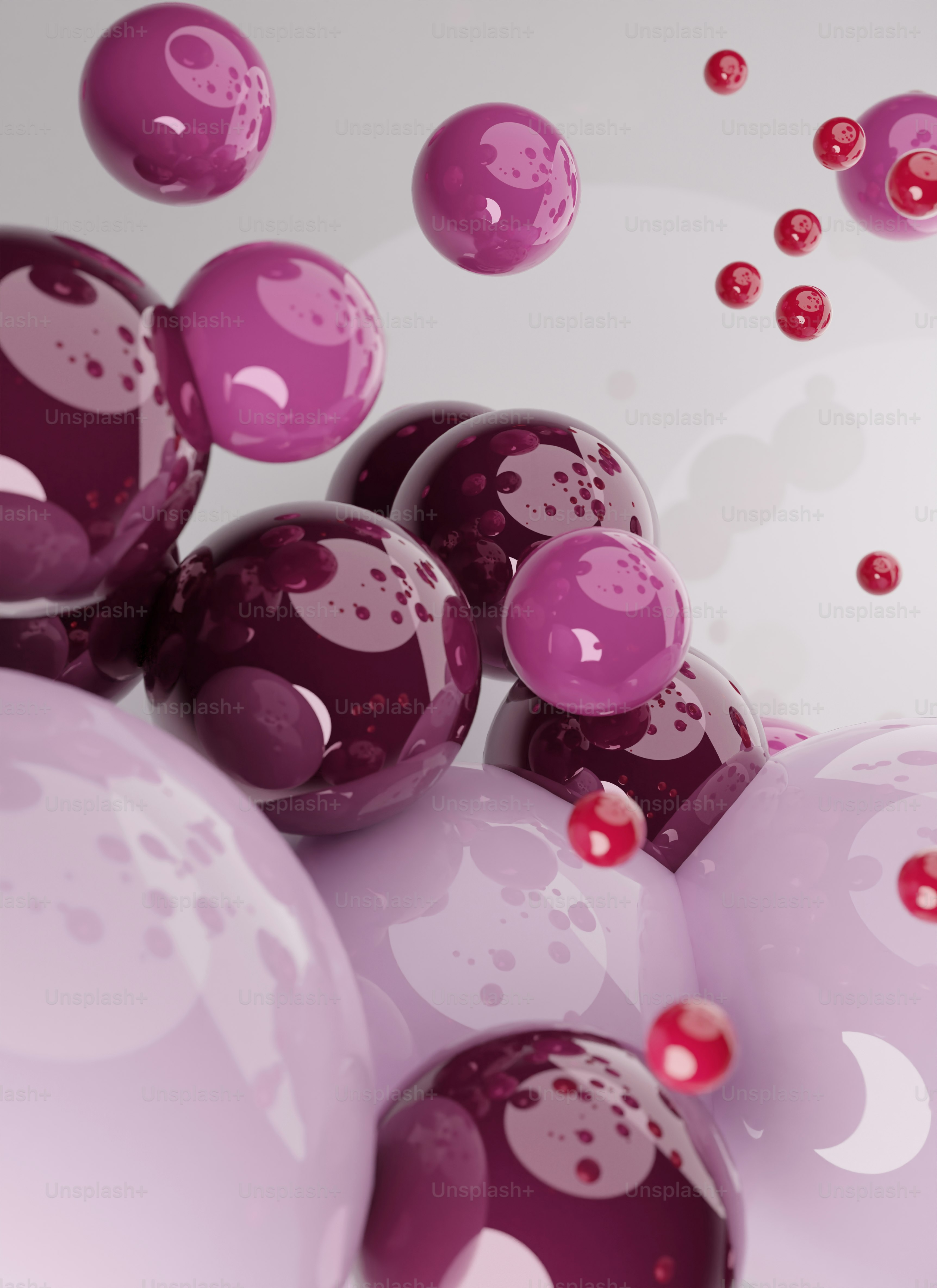 a bunch of purple and red balls floating in the air