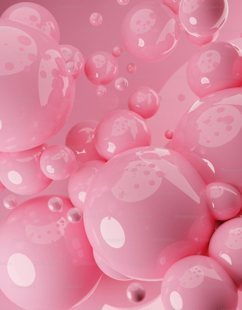 a bunch of pink bubbles floating in the air