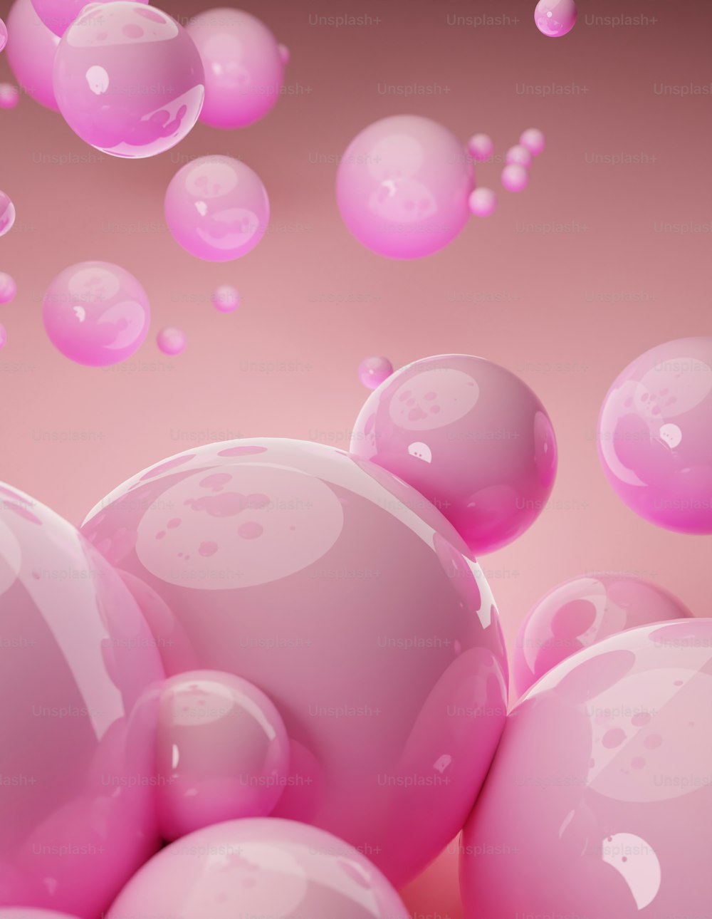 a bunch of pink bubbles floating in the air