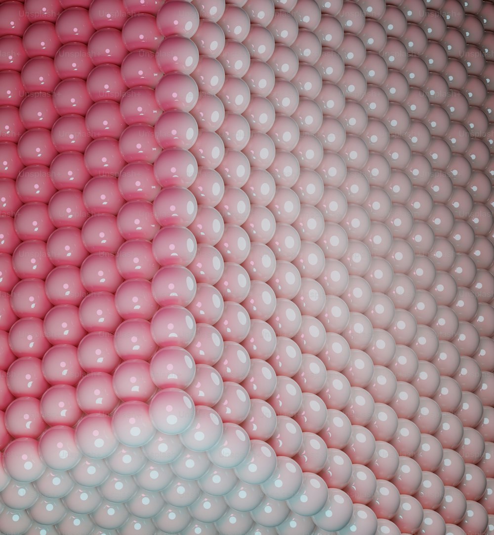 una gran cantidad de bolas blancas y rosadas