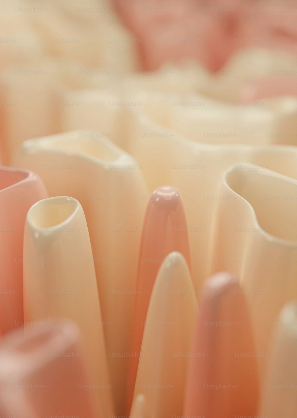 a close up of a bunch of pink vases