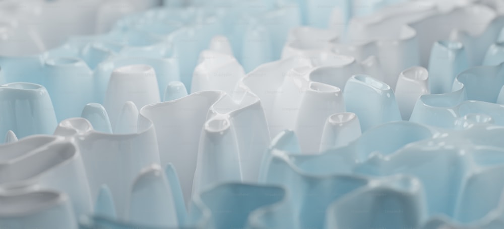 a large group of white vases sitting next to each other