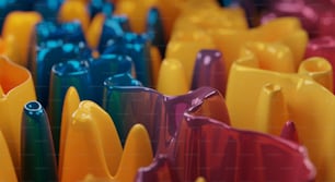 a close up of many different colored vases