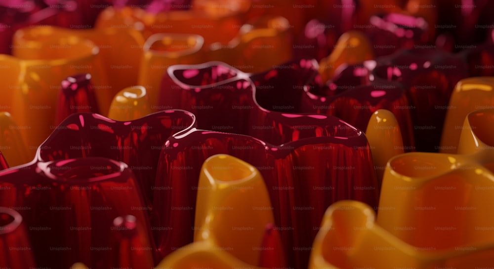 a group of red and yellow vases sitting next to each other