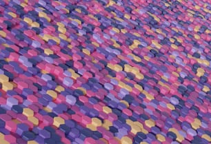 Una pared muy colorida formada por azulejos hexagonales