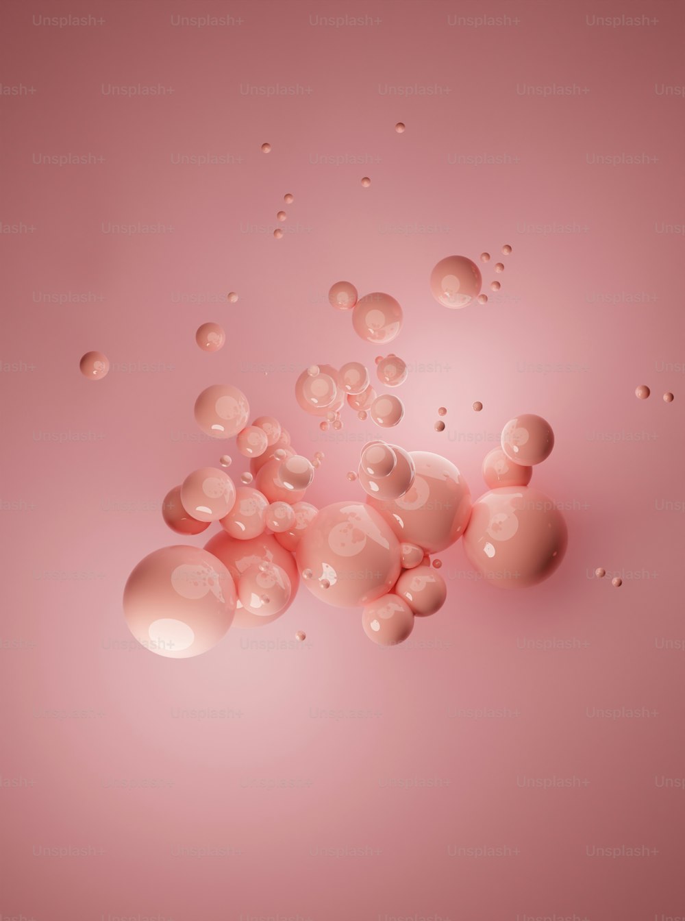 um grupo de bolhas flutuando em cima de uma superfície rosa