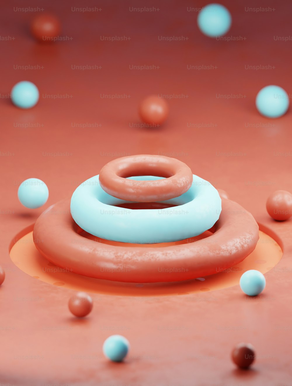 uma rosquinha sentada em cima de uma mesa rodeada de bolas