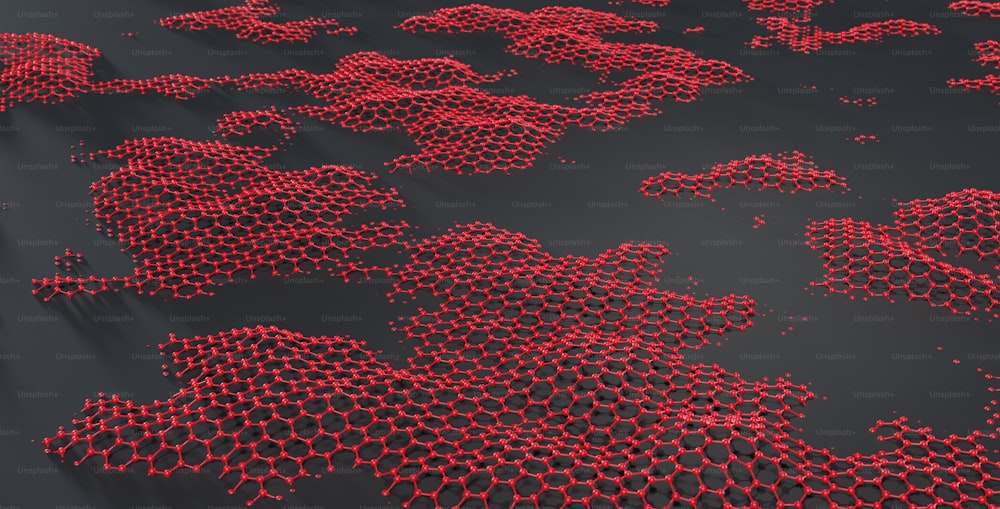 a bunch of red bubbles floating on top of a black surface