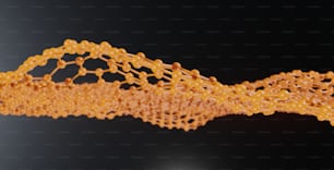 a close up of a piece of orange string