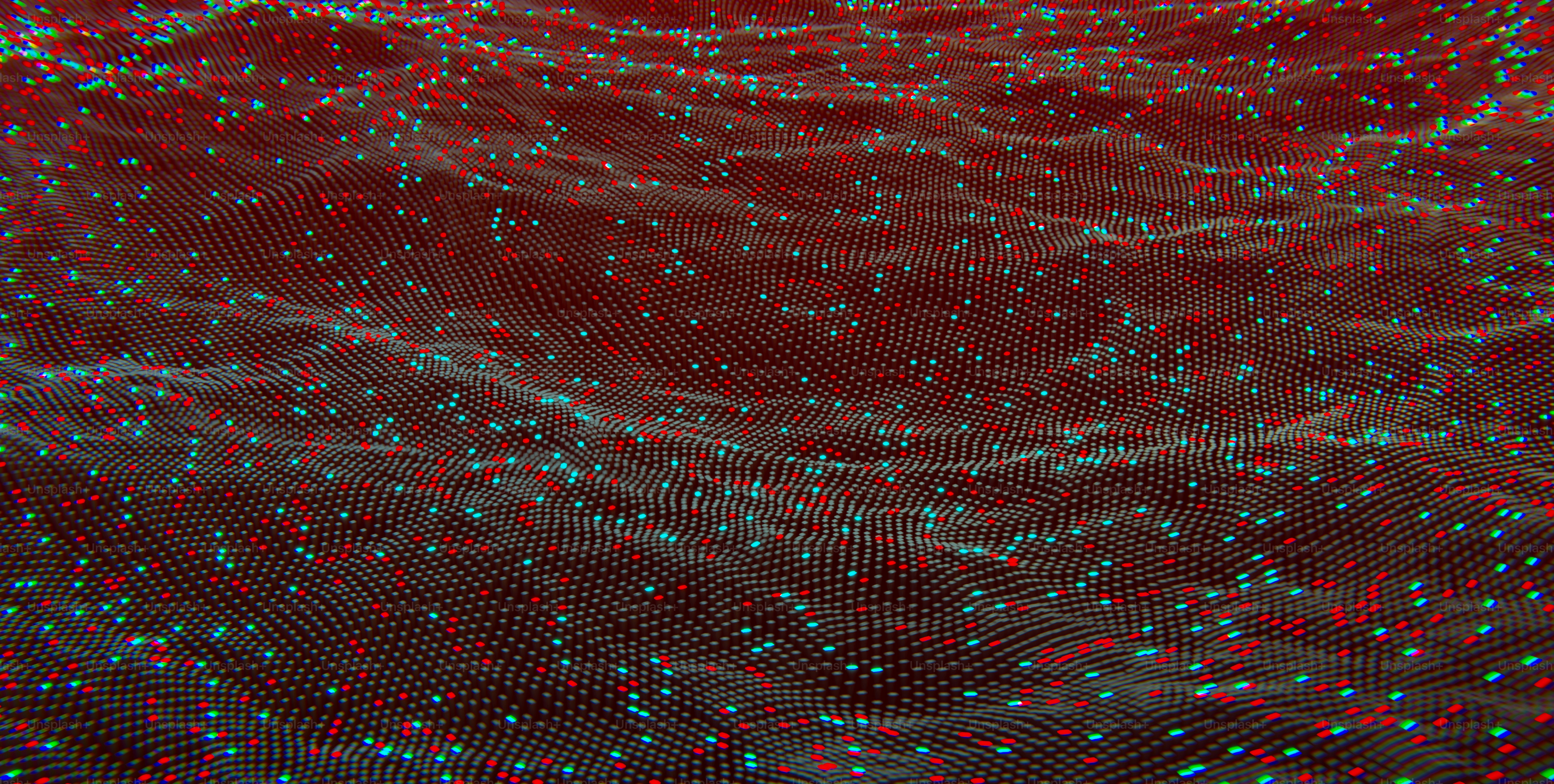 a red background with blue and green dots