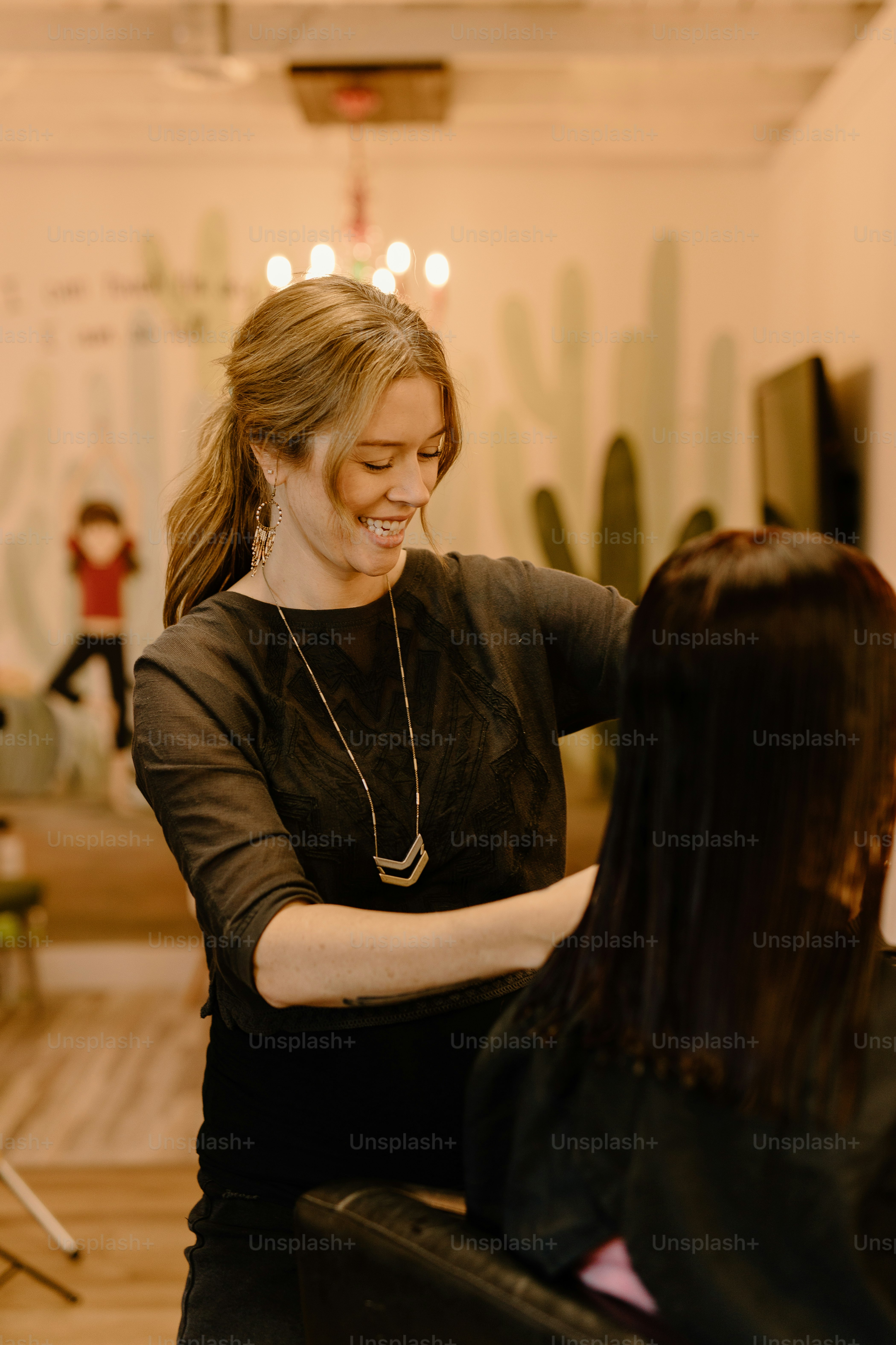 a woman getting her hair done in a salon
