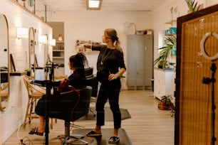 a woman getting her hair done in a salon