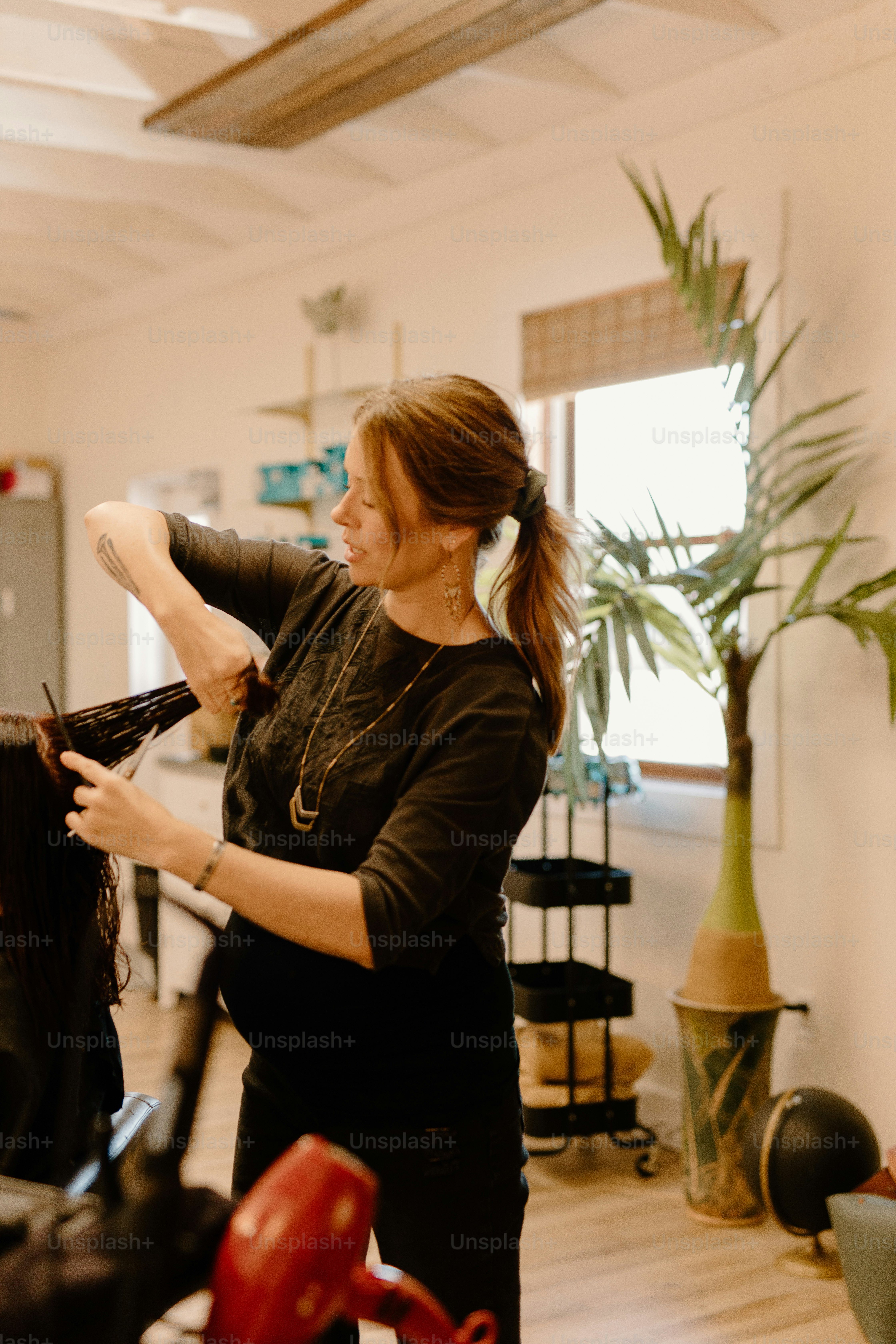a woman getting her hair done in a salon