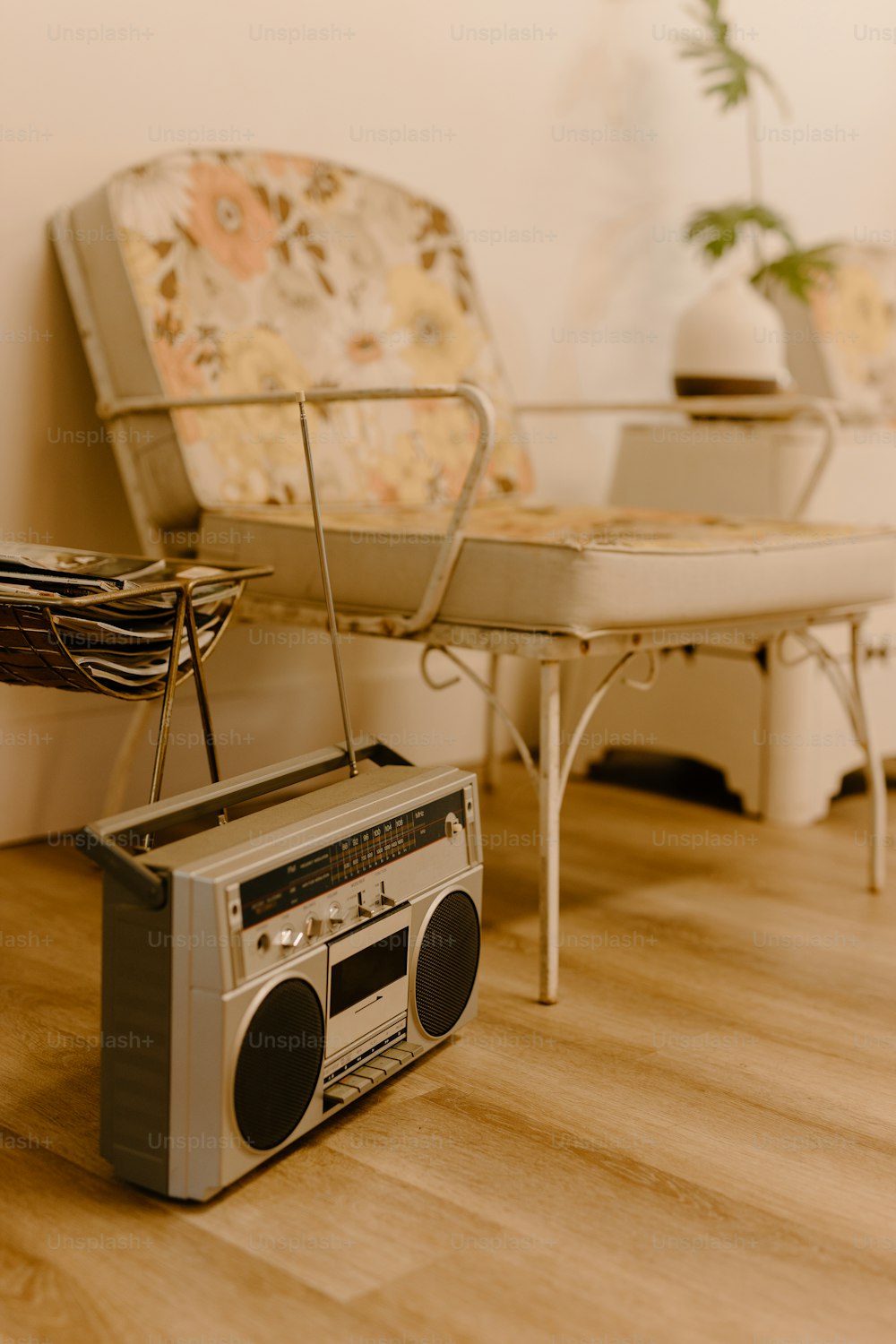a radio sitting on the floor next to a couch