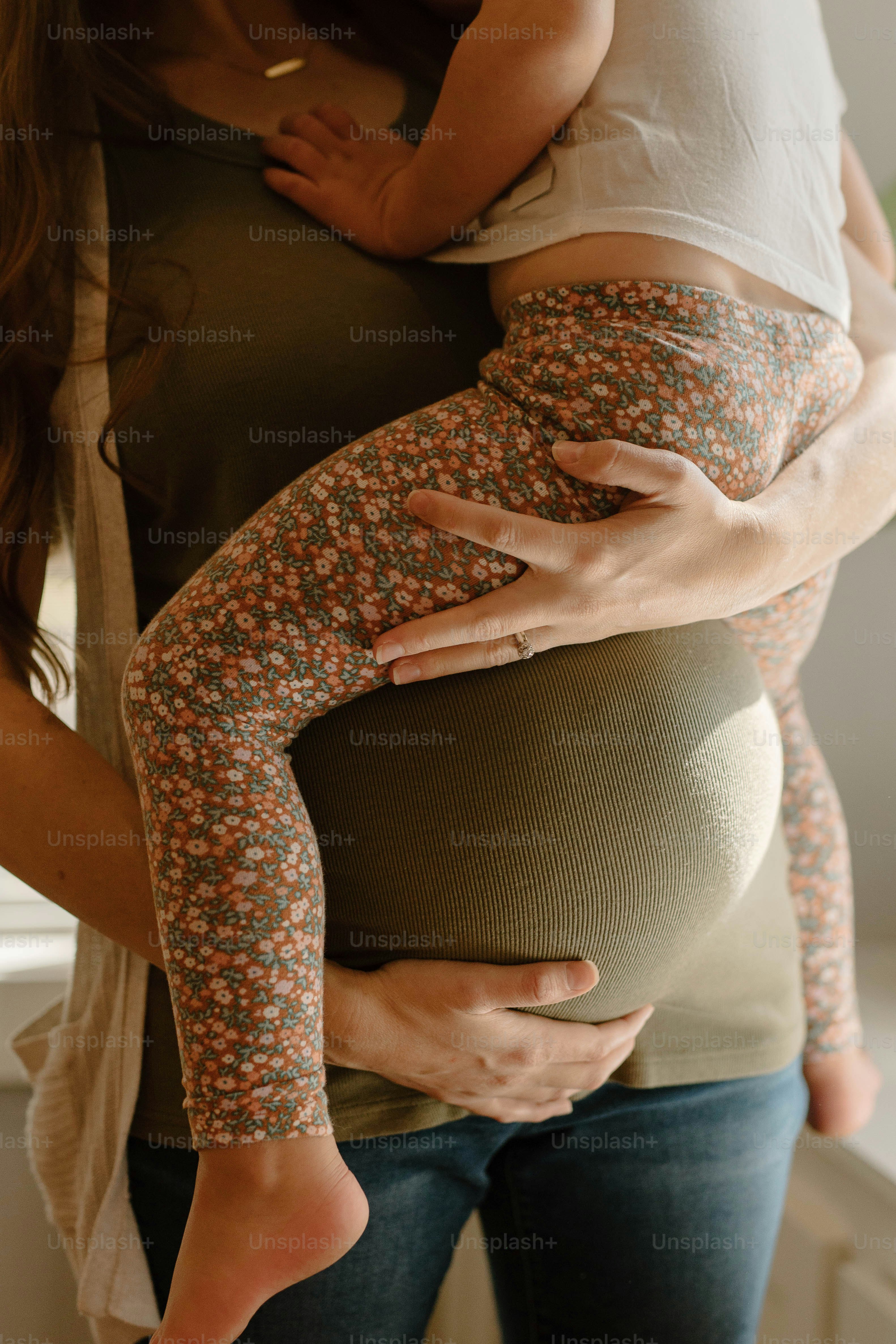 a woman holding a baby in her arms