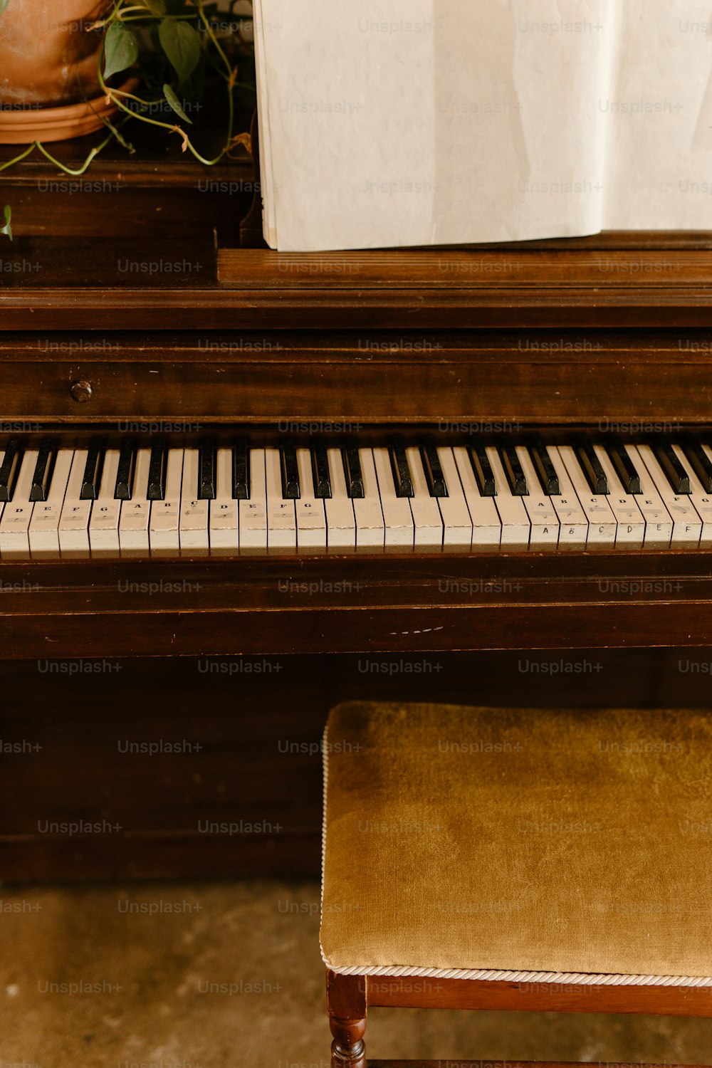 a piano with a bench next to it