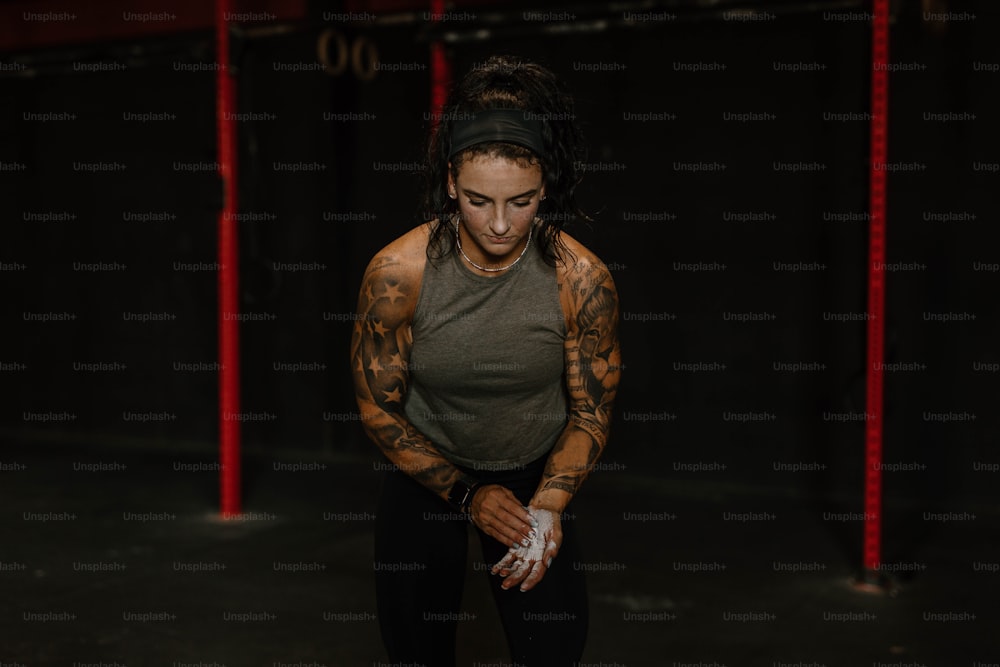 a woman with tattoos on her arms and arms