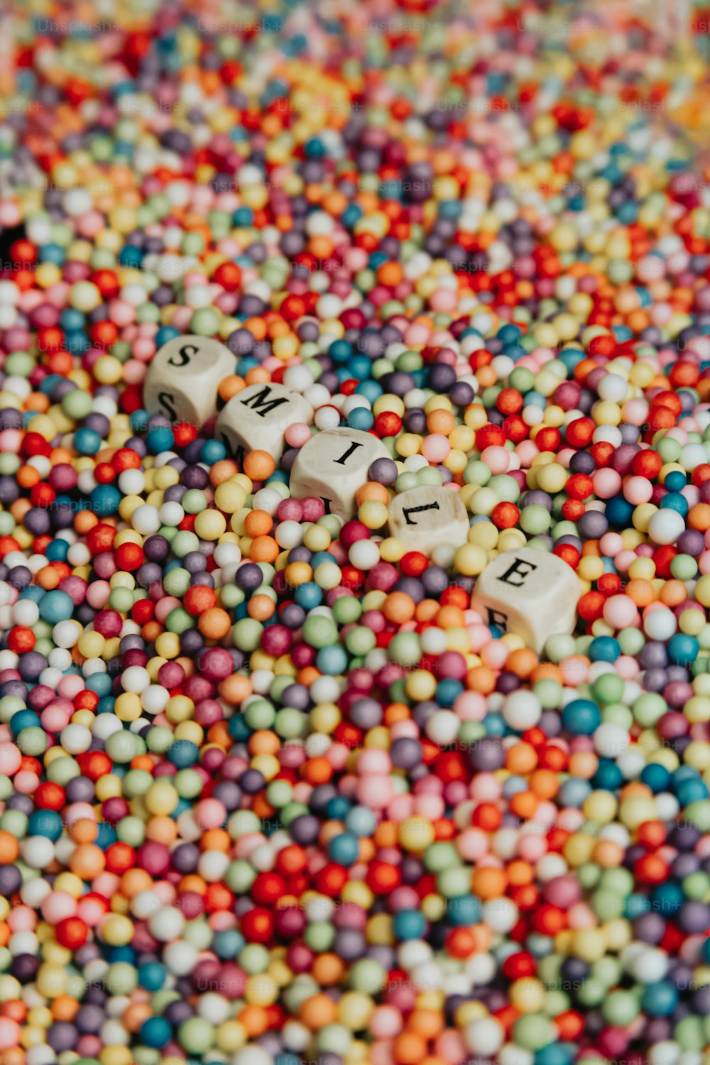 a close up of a bunch of beads with letters on them