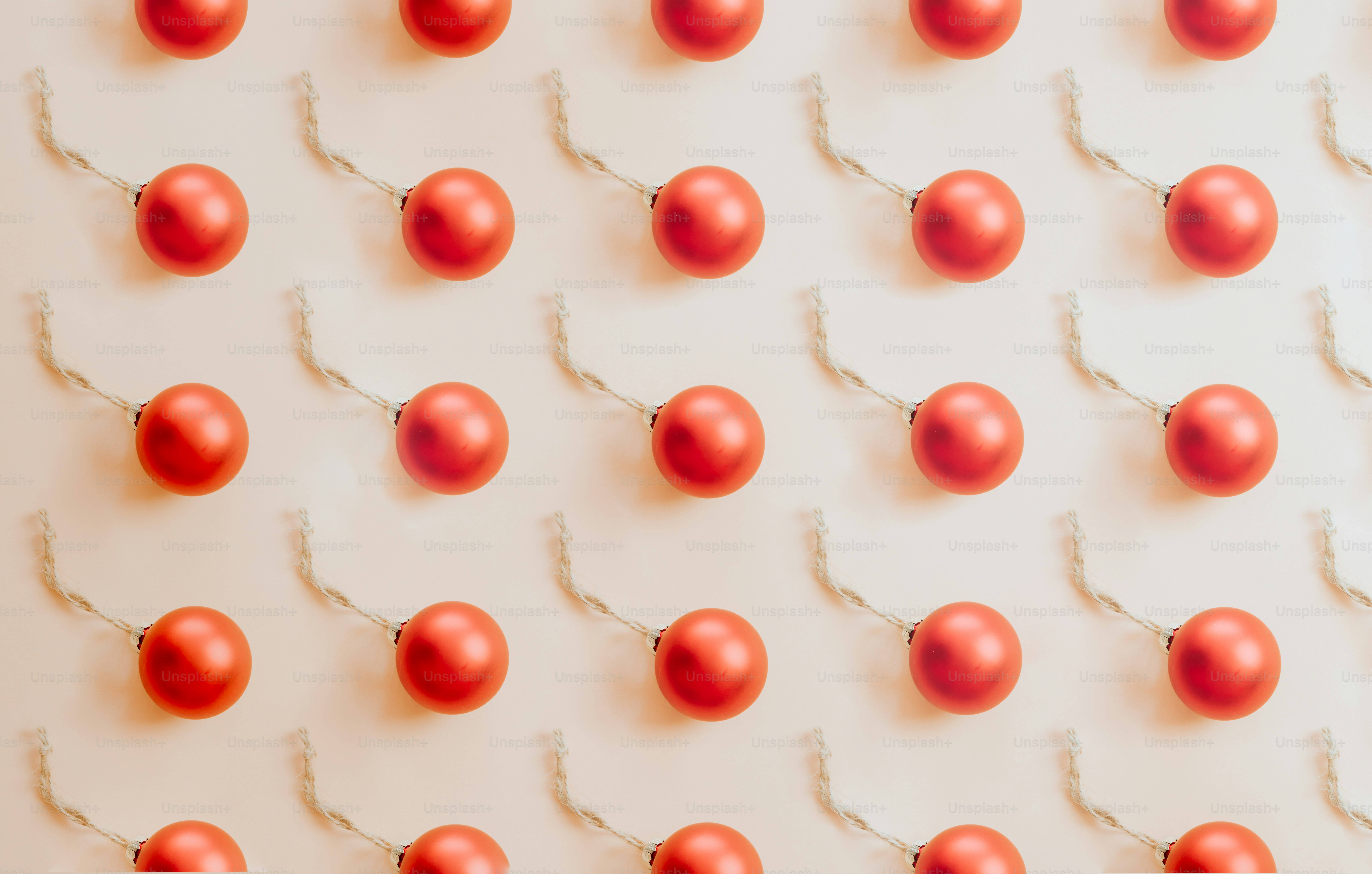 a group of red ornaments hanging from a string