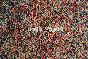 a close up of a pile of beads with the word do not enter spelled in