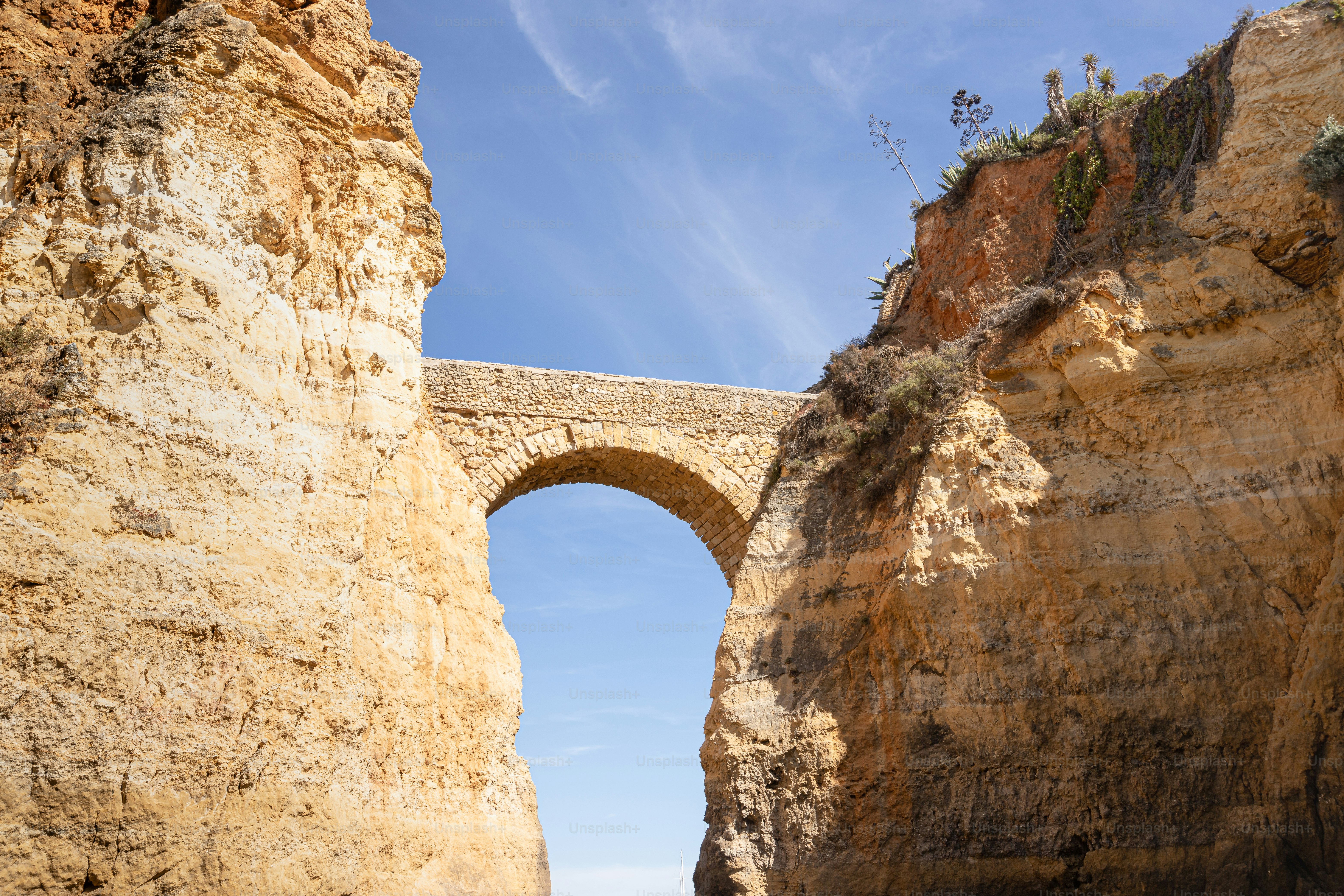 a stone bridge over a body of water