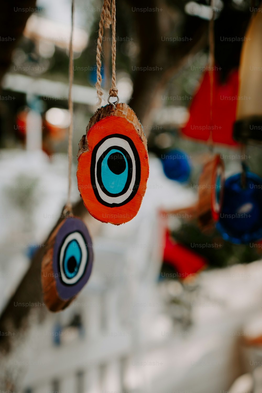 a close up of a wind chime hanging from a tree