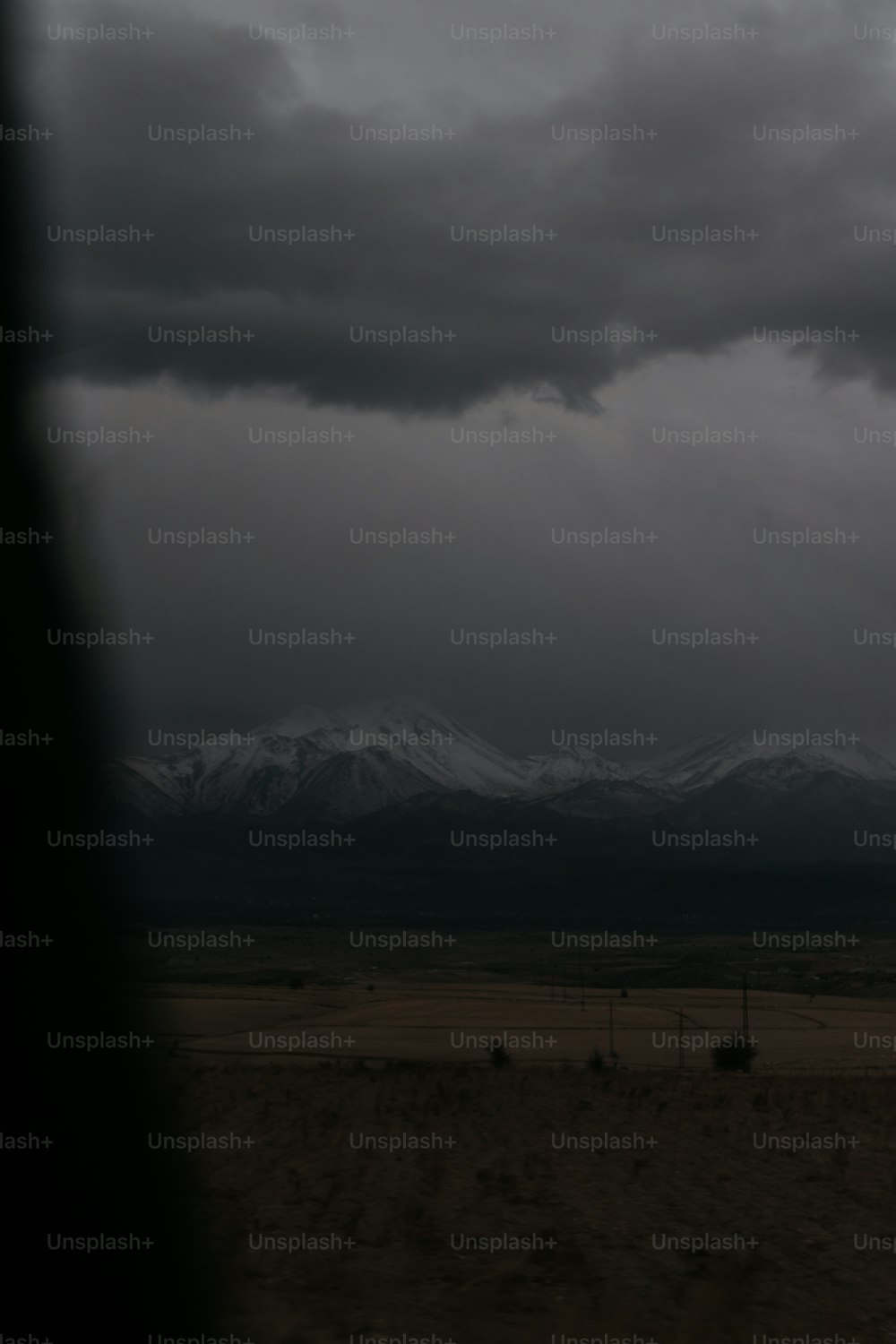 a black and white photo of a mountain range