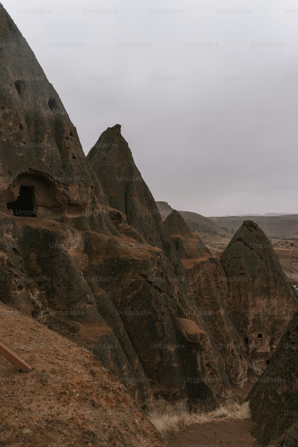 a large rock formation with a cave in the middle of it