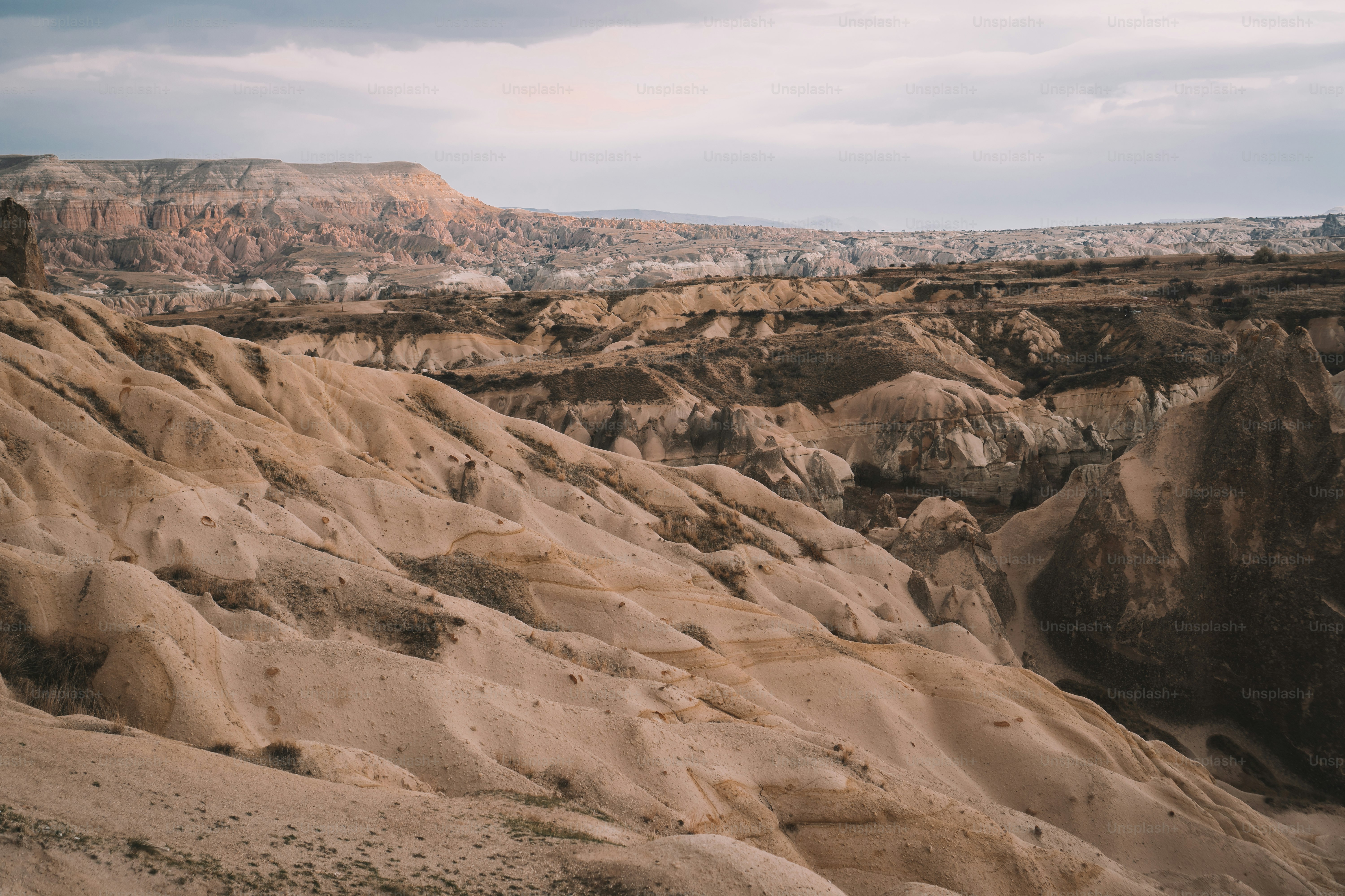 a view of a rocky landscape with a mountain in the background