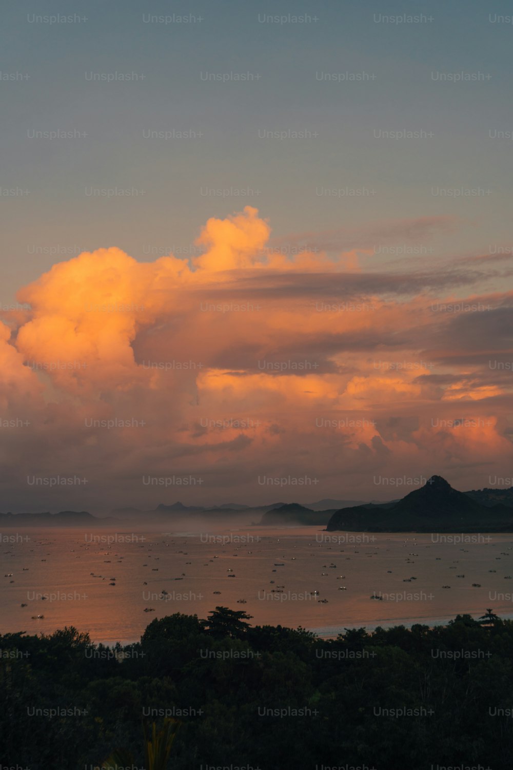 a large body of water under a cloudy sky