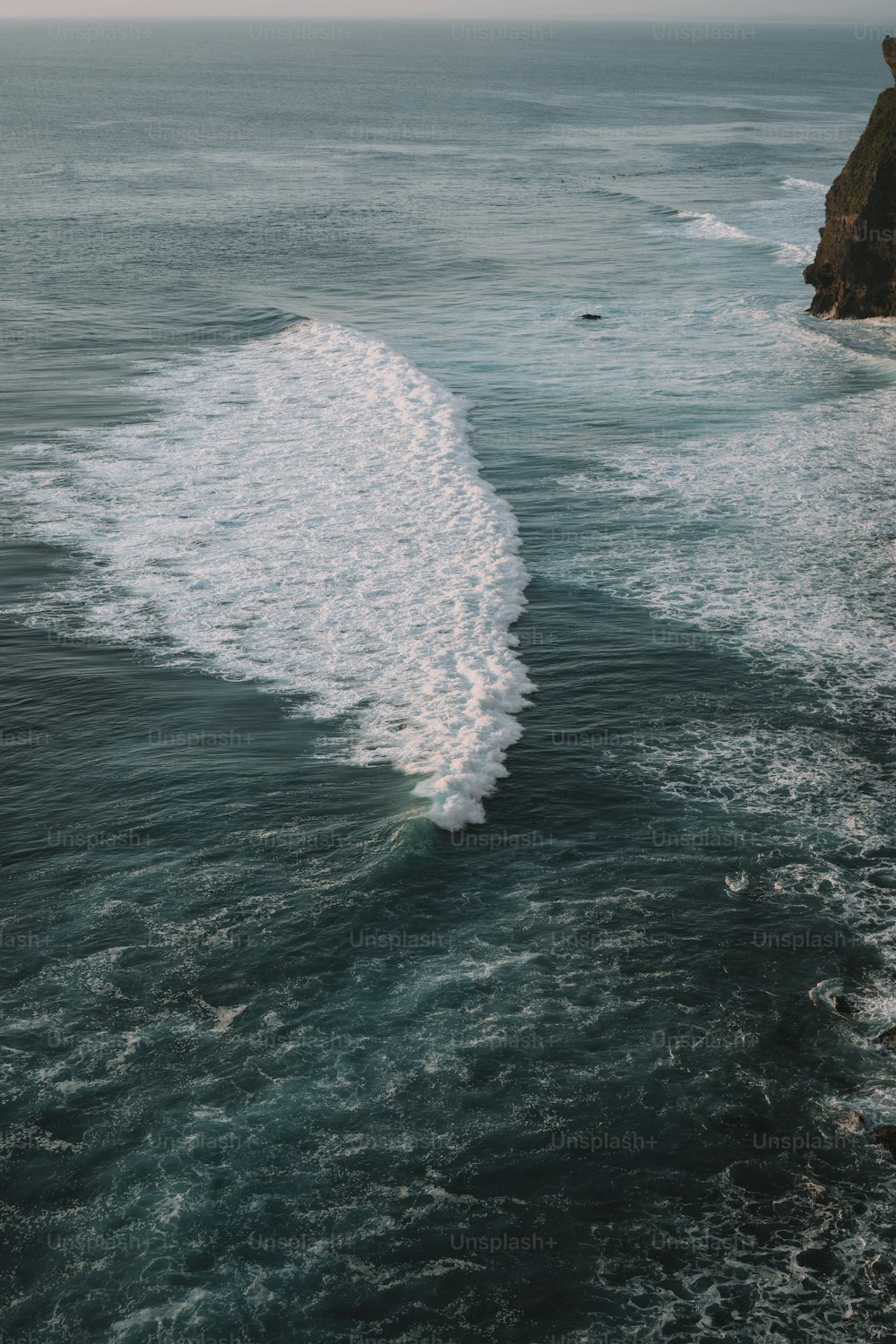 a large body of water near a cliff