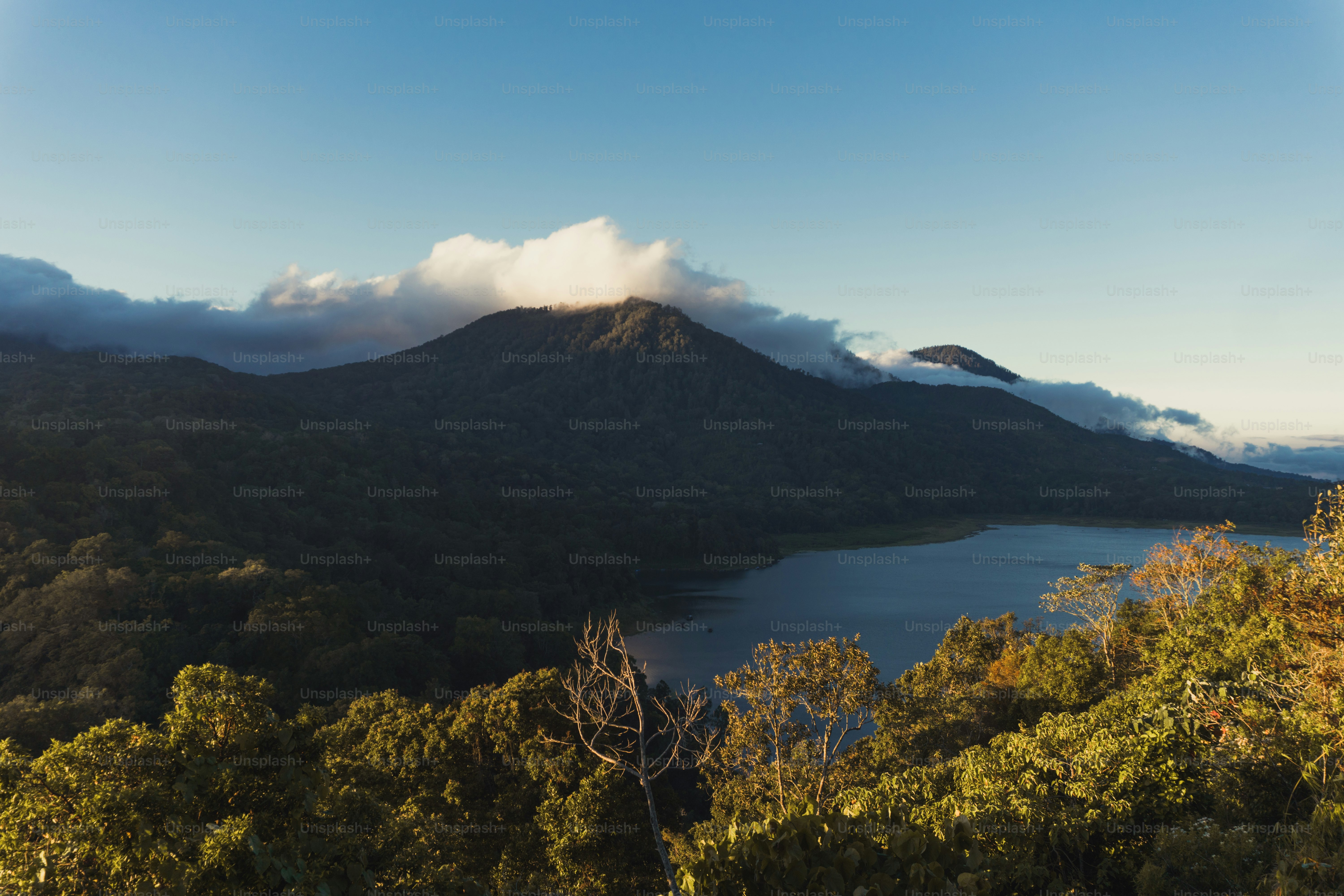 a mountain with a lake in the foreground