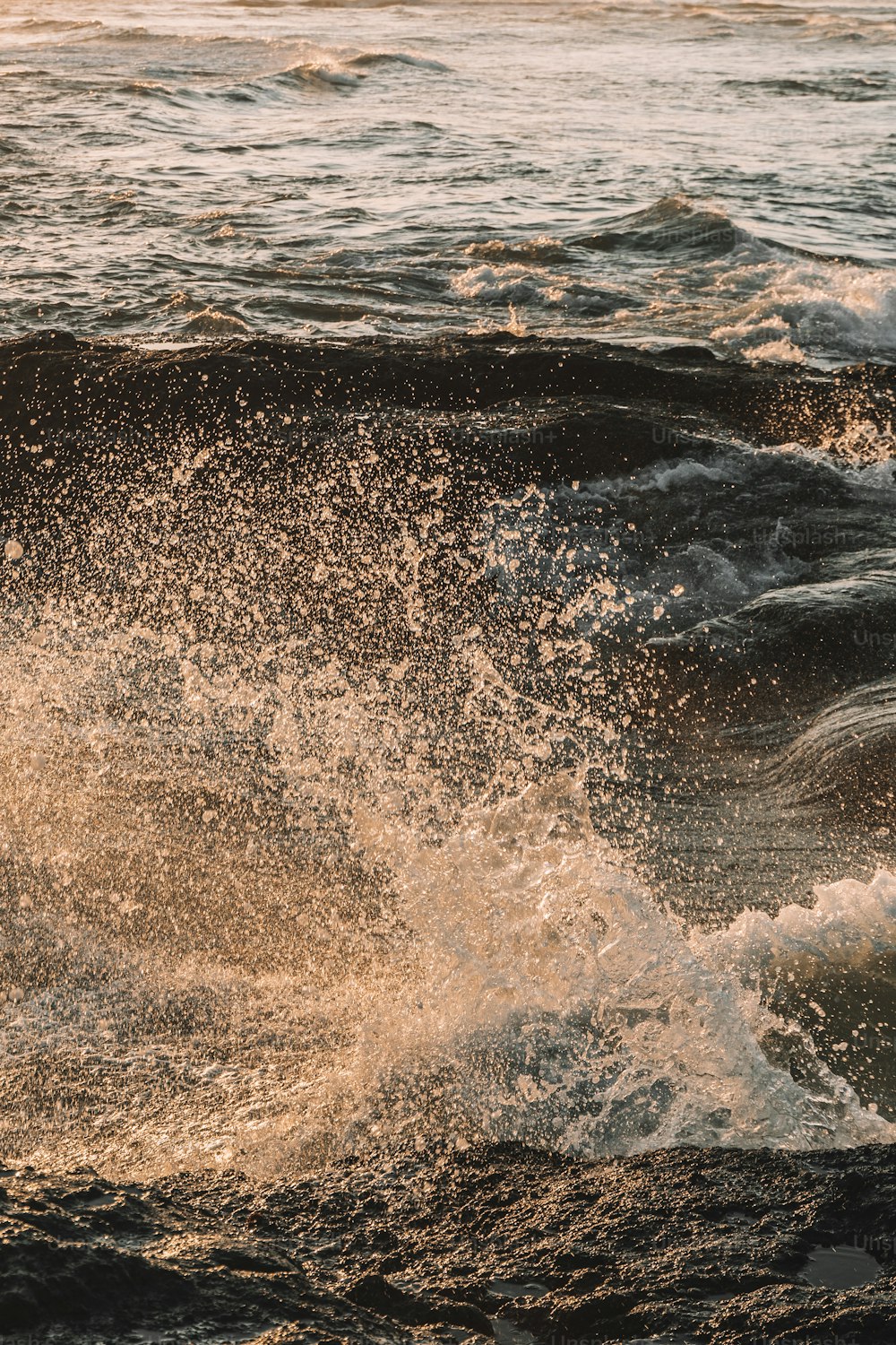 a man riding a wave on top of a surfboard