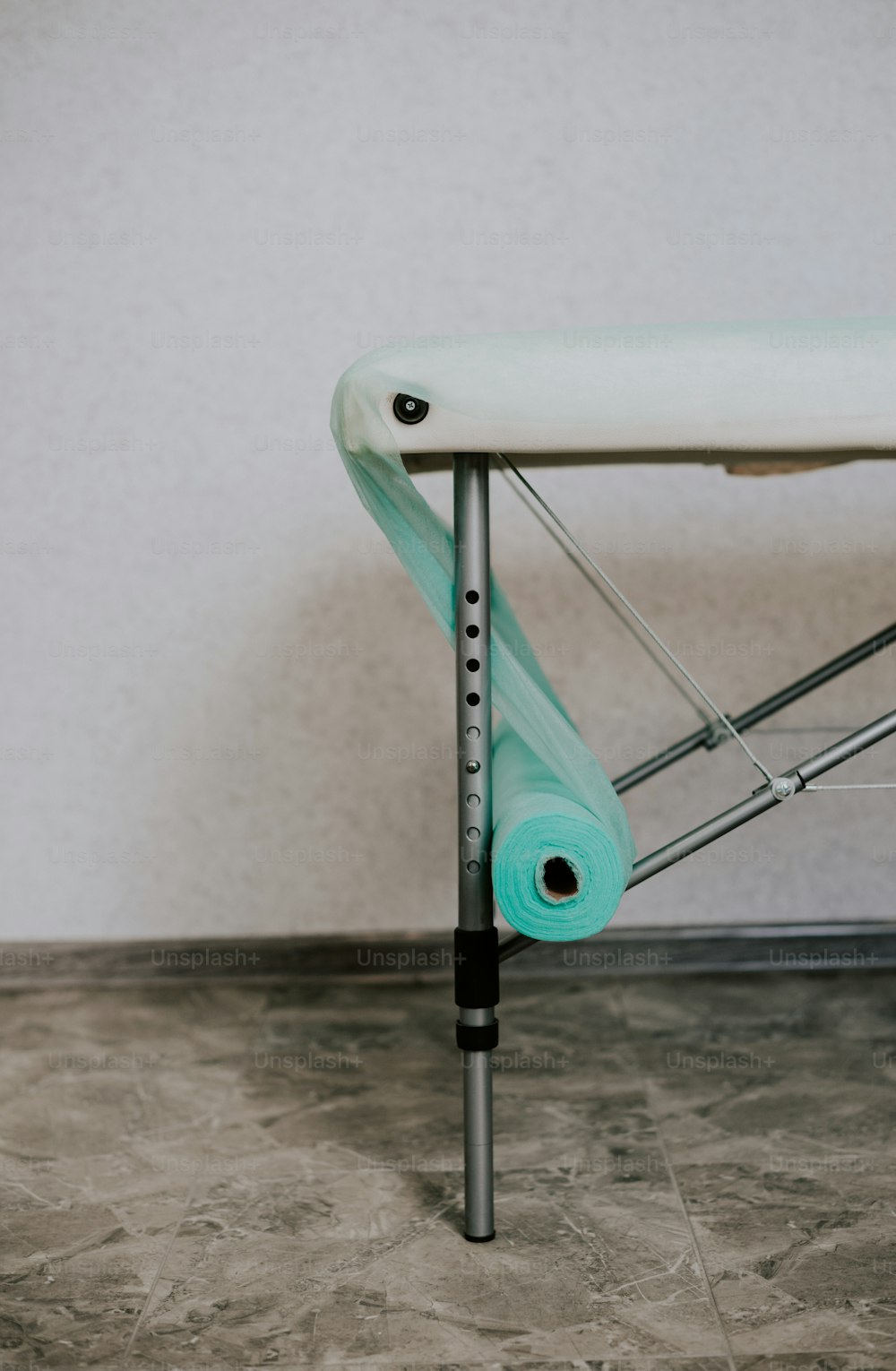 a white ironing board sitting on top of a table