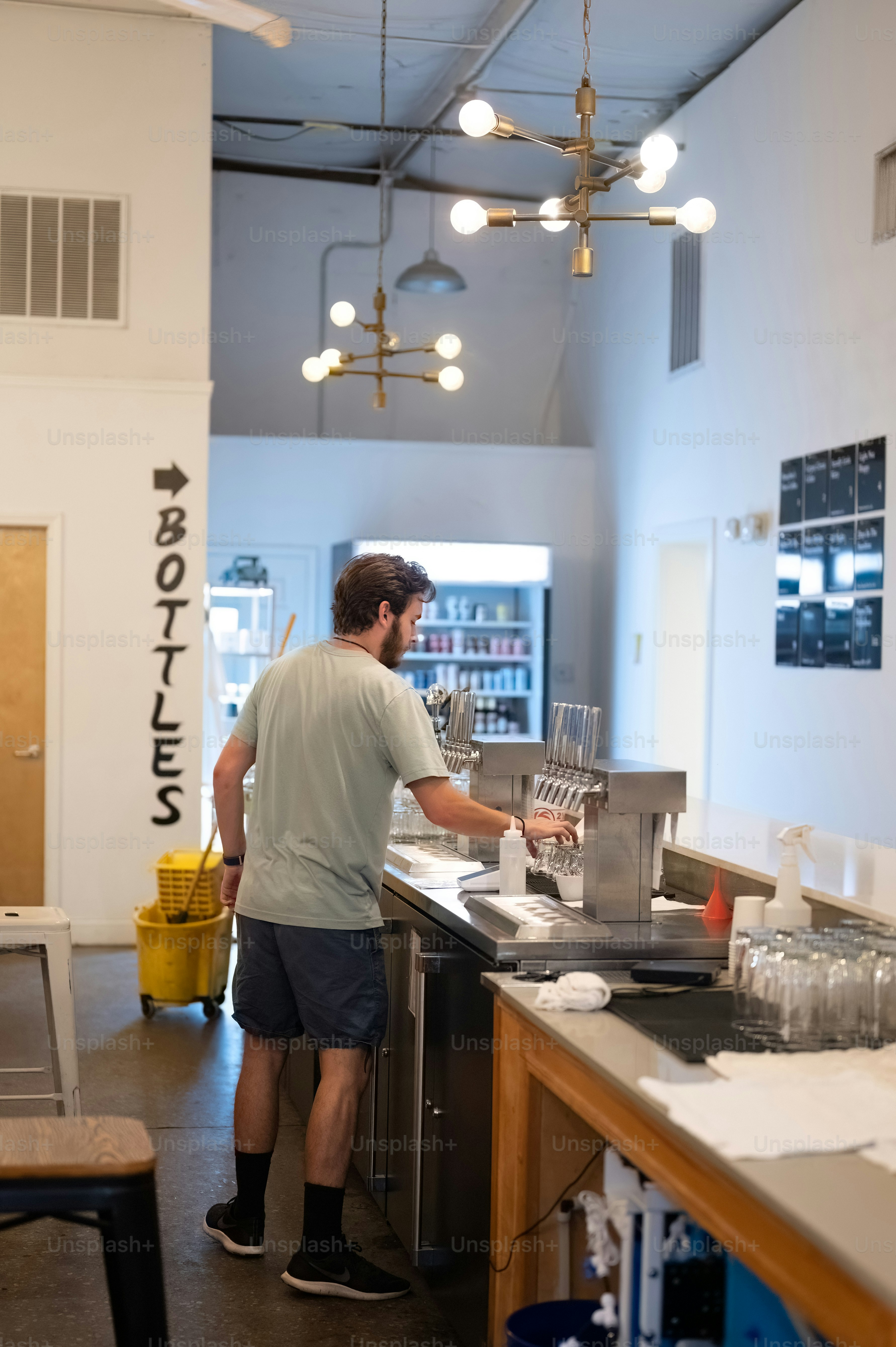 a man standing in a kitchen preparing food