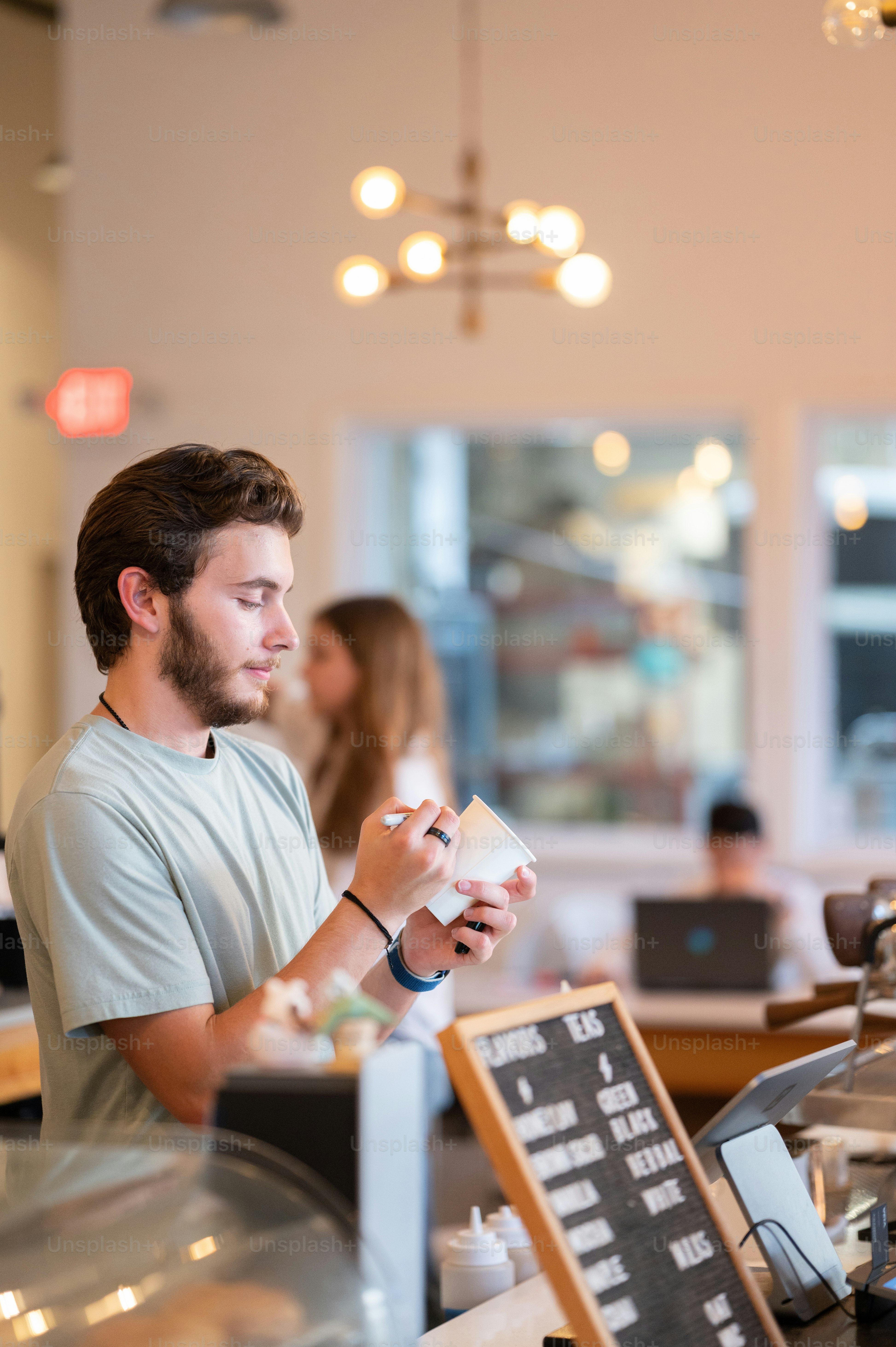 a man sitting at a counter in a restaurant