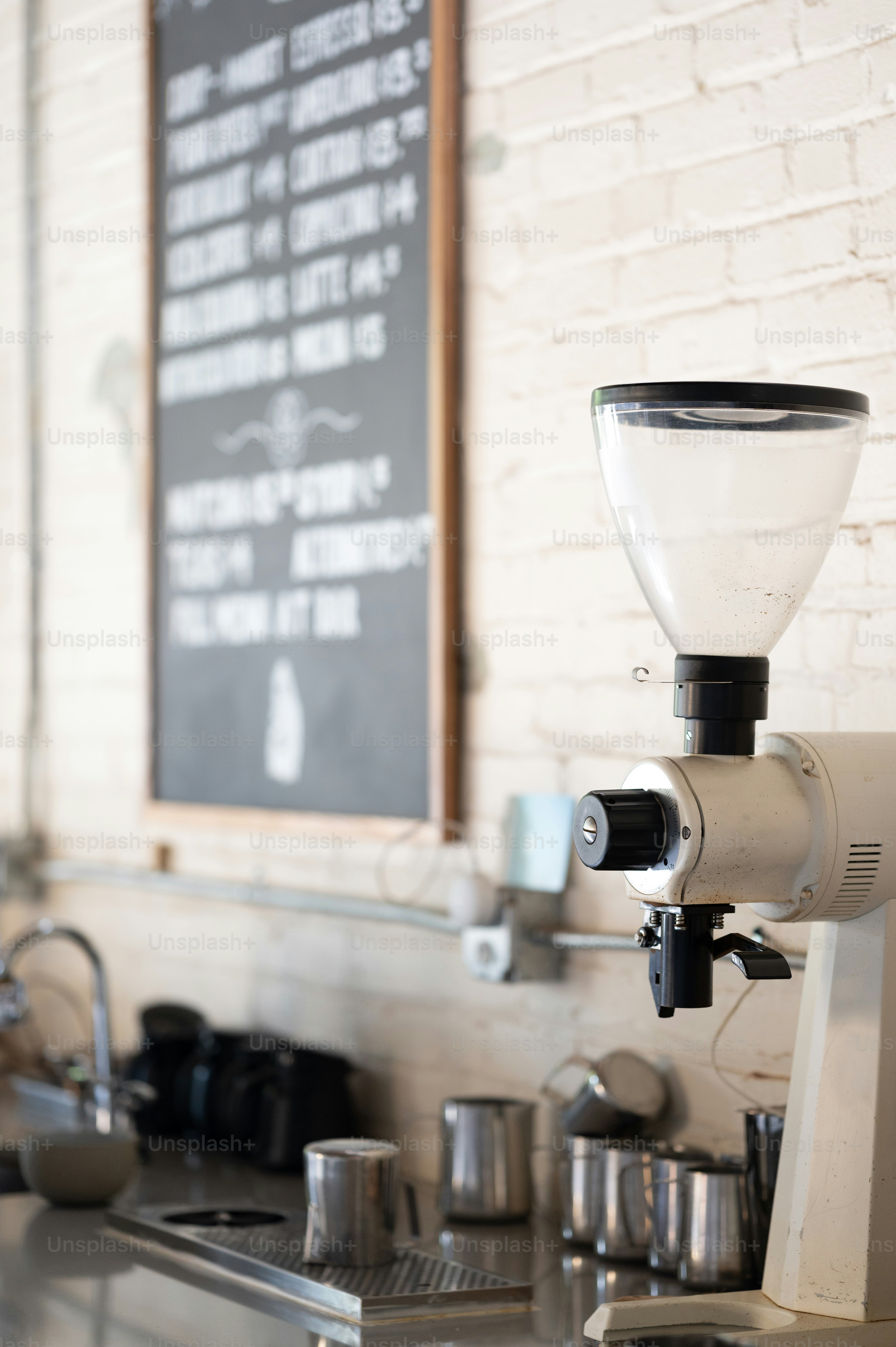 a coffee machine sitting on top of a metal counter