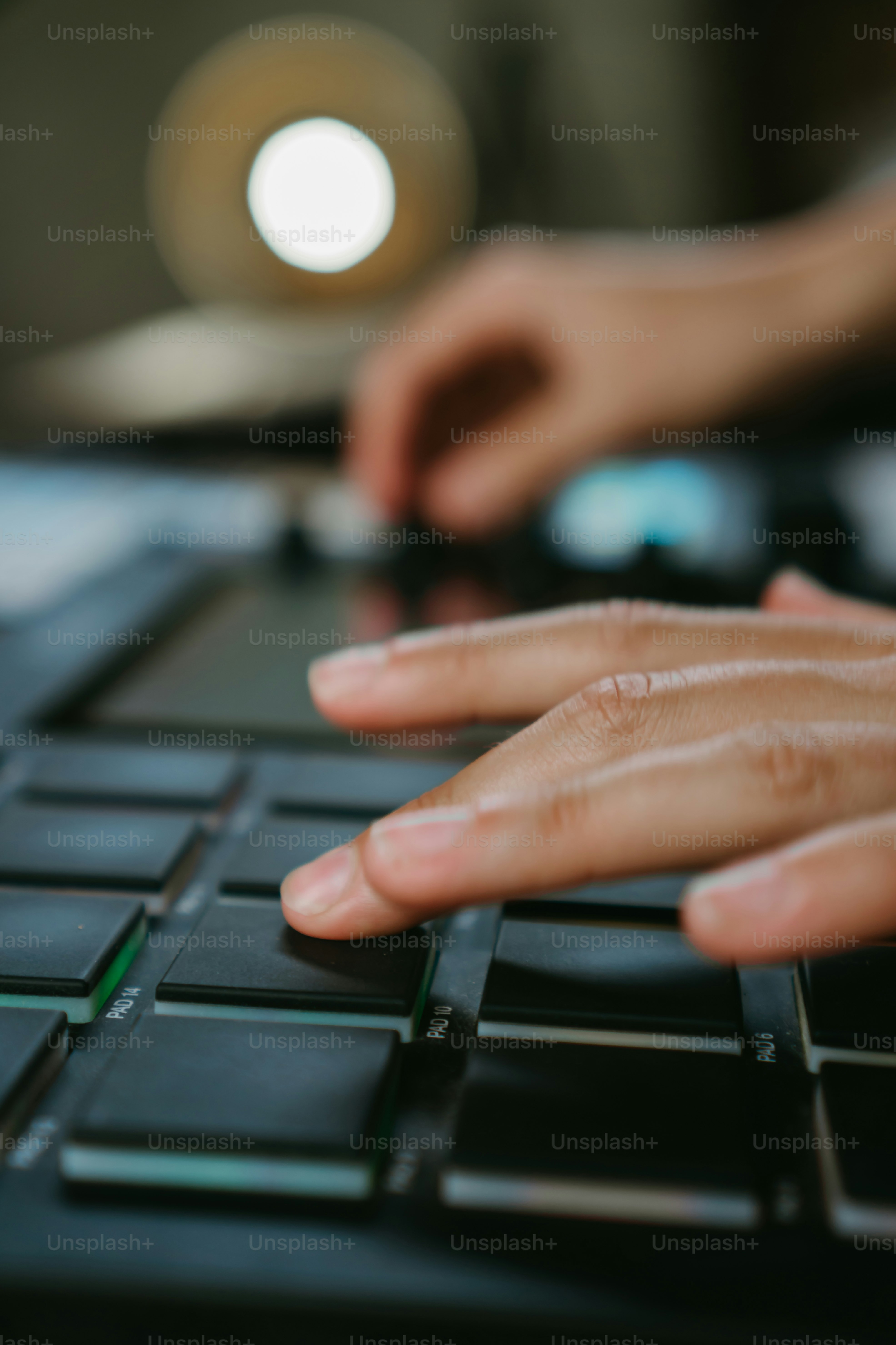 a close up of a person typing on a keyboard