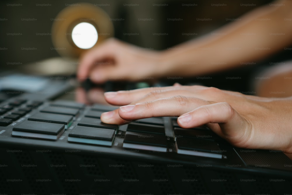 a close up of a person typing on a keyboard